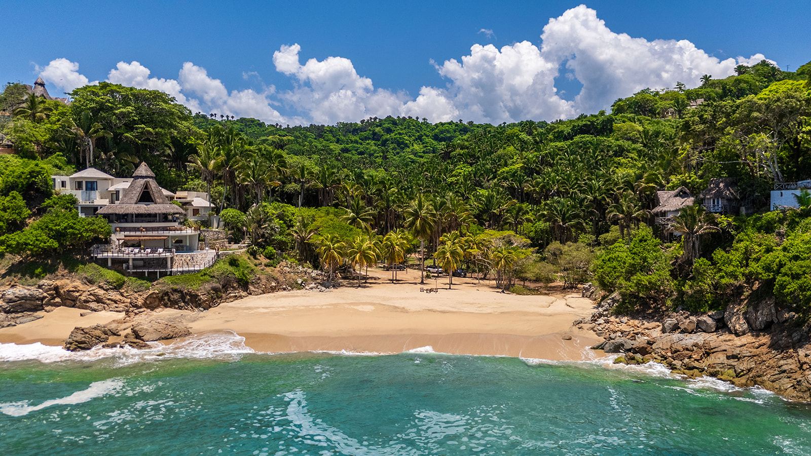 Aerial view of the cove with both villas in the jungle